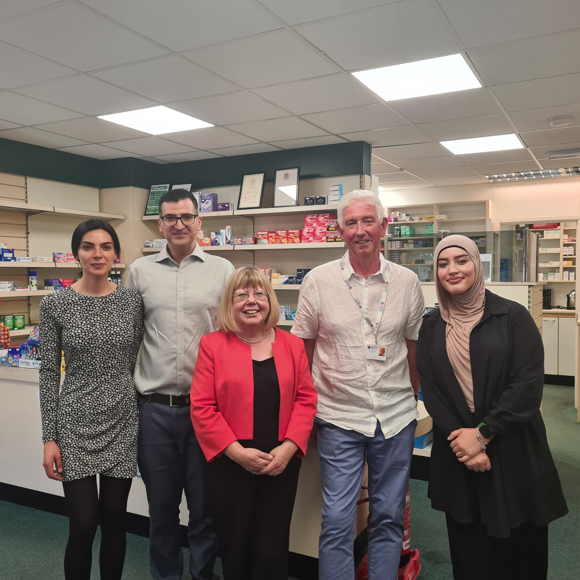 Group photo with Liz Twist MP inside the pharmacy